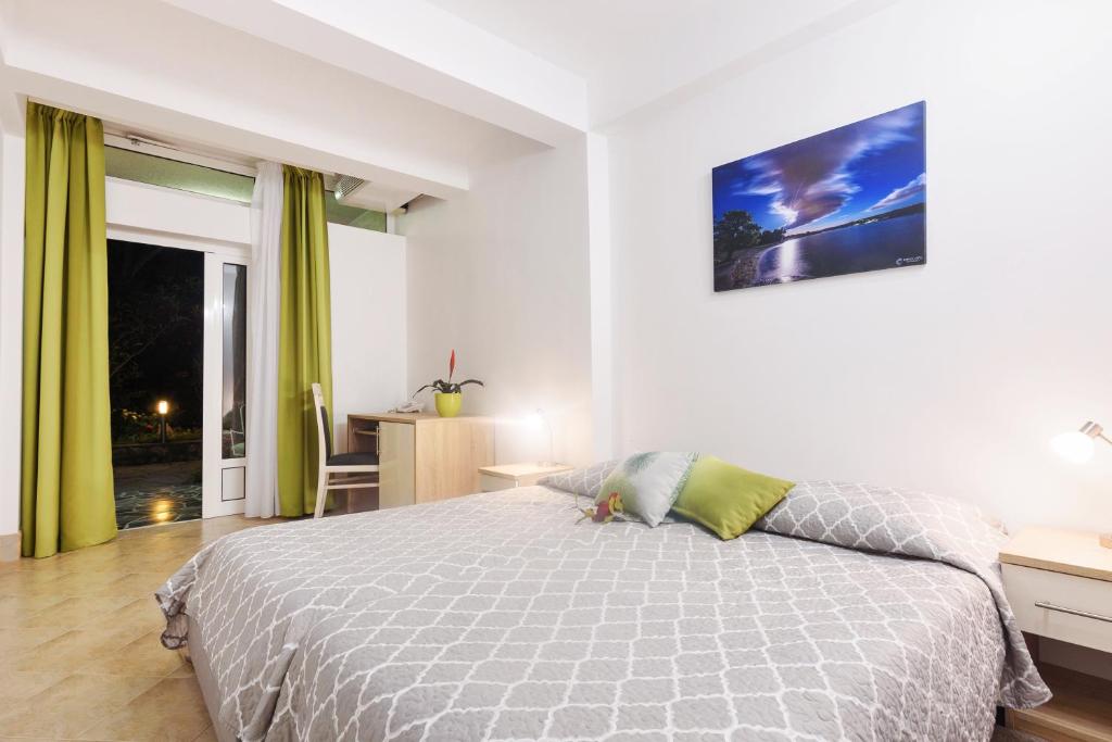 Postel nebo postele na pokoji v ubytování Villa Vicko