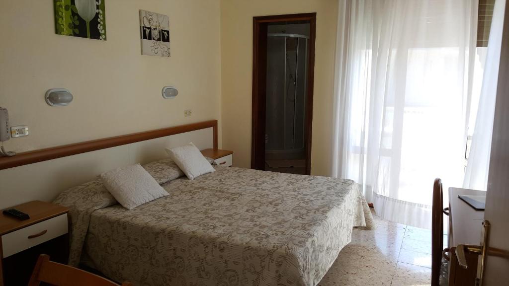 Postel nebo postele na pokoji v ubytování Hotel Marietta