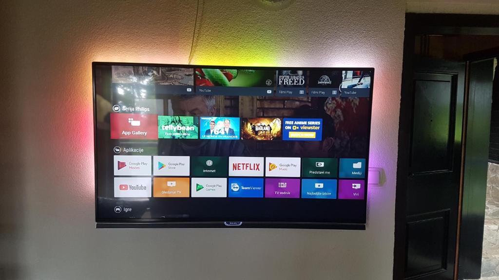 a flat screen tv hanging on a wall at Rogla - Chalet Mojca Pokrajculja in Zreče