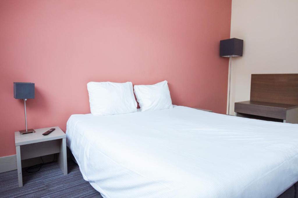 Postel nebo postele na pokoji v ubytování Enjoy Hotel Blankenberge - Pantheon Palace By WP Hotels