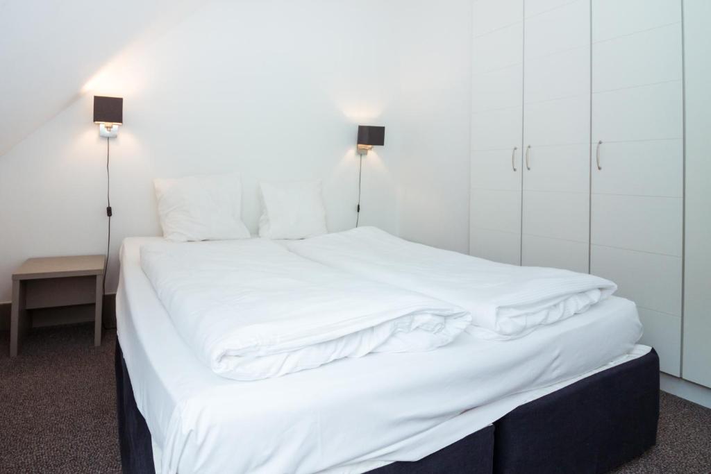 Postel nebo postele na pokoji v ubytování Enjoy Hotel Blankenberge - Pantheon Palace By WP Hotels