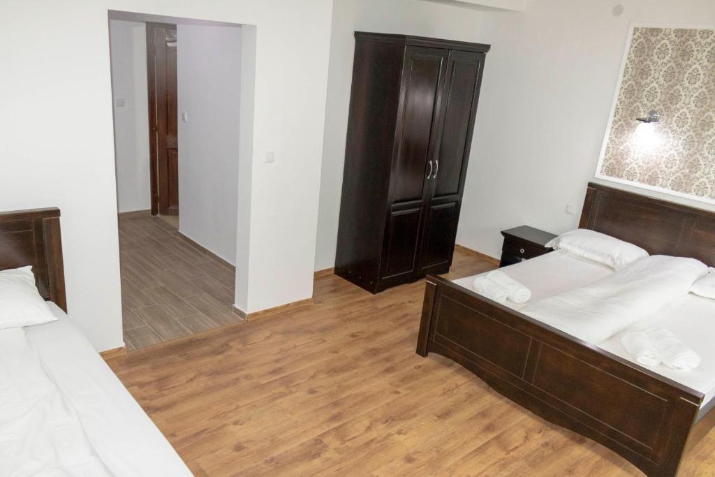 Postel nebo postele na pokoji v ubytování Casa Valea Cernei