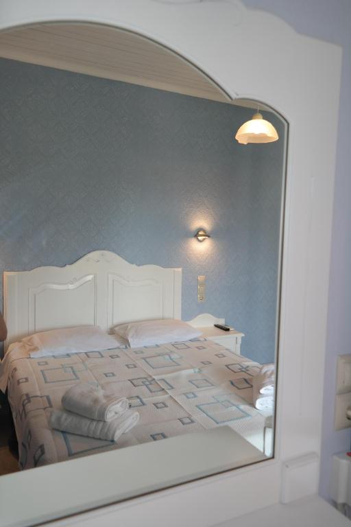 Postel nebo postele na pokoji v ubytování Hotel Avra