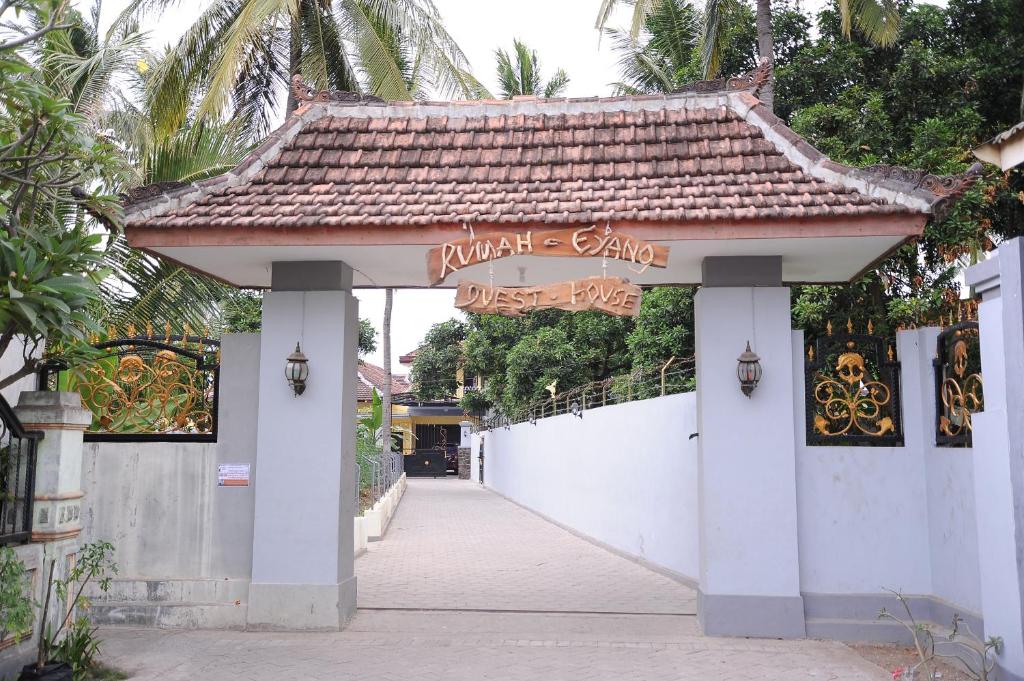 a building with a sign that reads private estate at Rumah Eyang Guest House in Banyuwangi