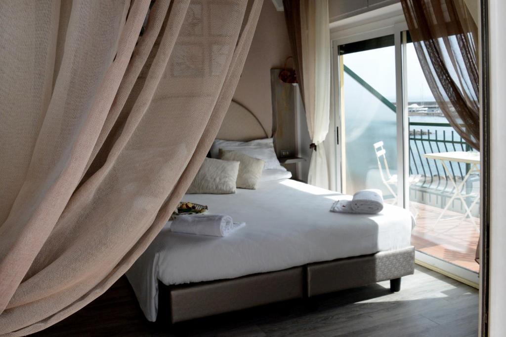 Postel nebo postele na pokoji v ubytování Hotel Zia Piera