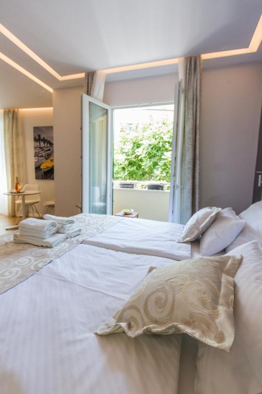 Posteľ alebo postele v izbe v ubytovaní AML apartments