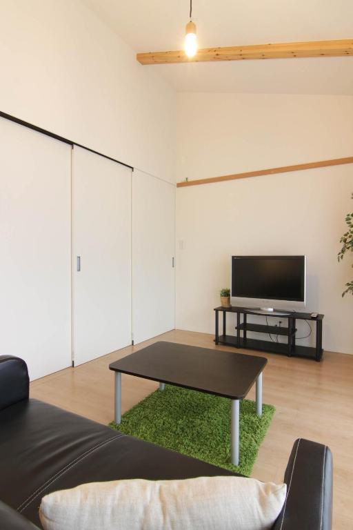 TV a/nebo společenská místnost v ubytování Guesthouse Tokushima