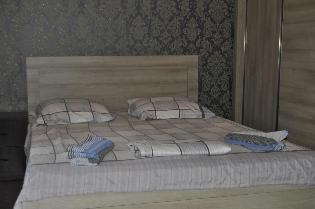 Postel nebo postele na pokoji v ubytování Guesthouse Dariali