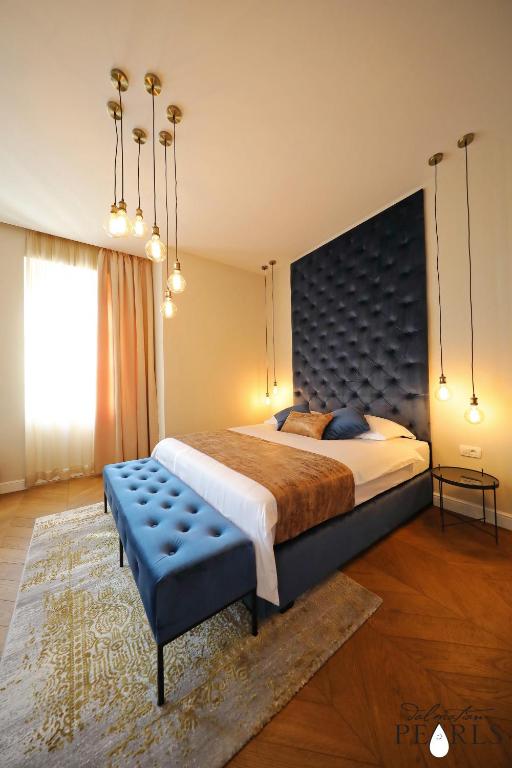 Postel nebo postele na pokoji v ubytování Three Pearls Deluxe Rooms & Studios