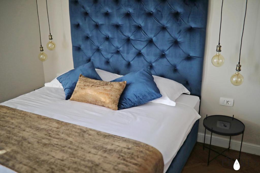 Postel nebo postele na pokoji v ubytování Three Pearls Deluxe Rooms & Studios