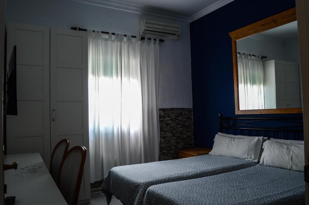 Postel nebo postele na pokoji v ubytování Hostal Playa Hidalgo