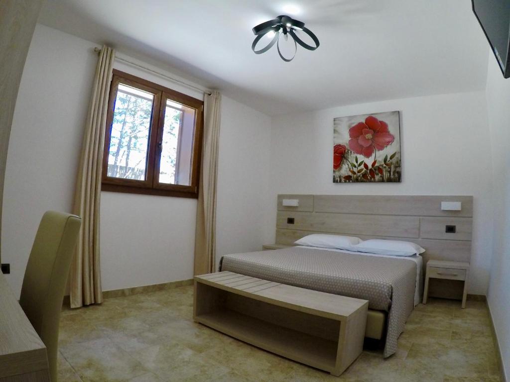 Postel nebo postele na pokoji v ubytování B. & B. Lu Turnitu