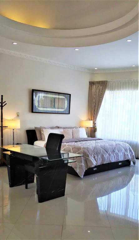Postel nebo postele na pokoji v ubytování Alameda Cariari Boutique Hotel