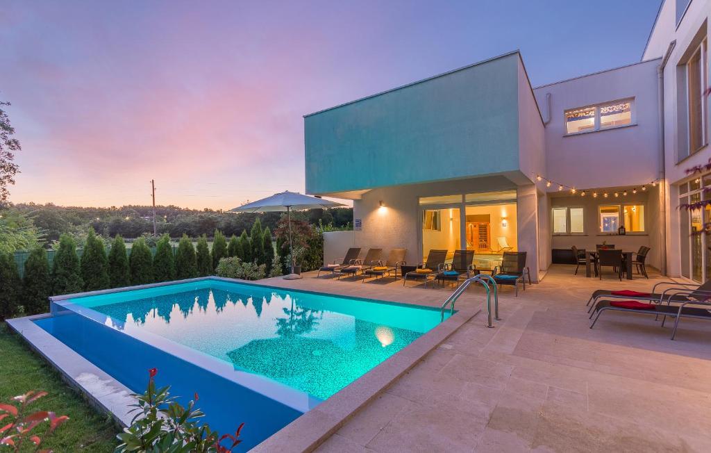 a swimming pool in the backyard of a house at Villa Kate Istria in Žminj