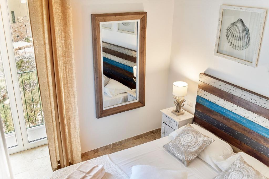 Postel nebo postele na pokoji v ubytování POSEA - Polignano Sea Suites