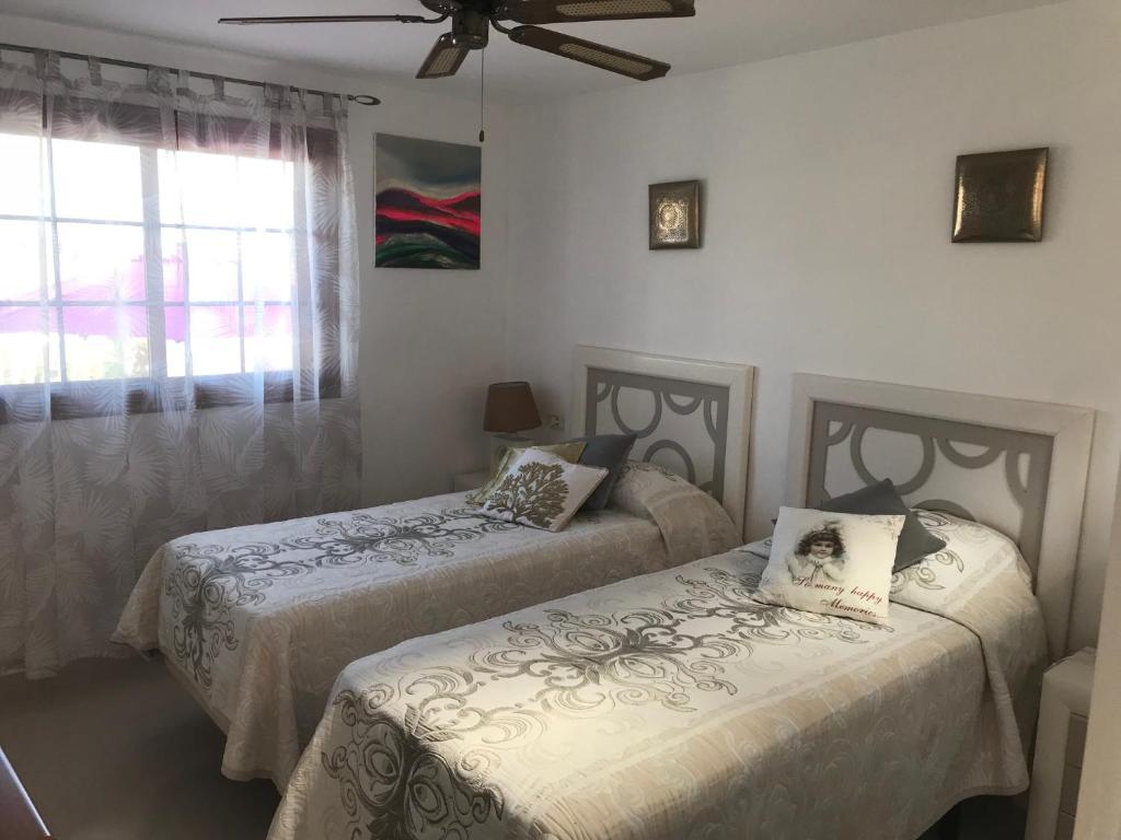 A bed or beds in a room at Villa Ola, Golf del Sur