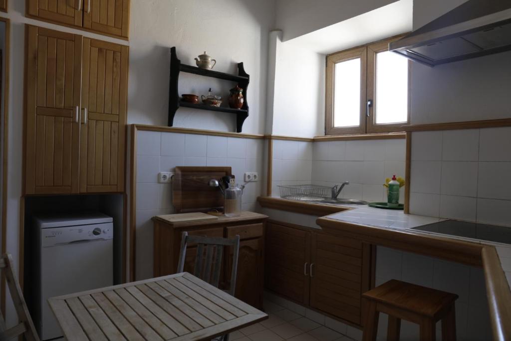 Kuchyň nebo kuchyňský kout v ubytování Apartamento en casa del s.XVI