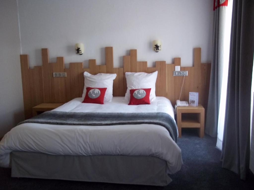 Postel nebo postele na pokoji v ubytování Hôtel L'Ensoleillé