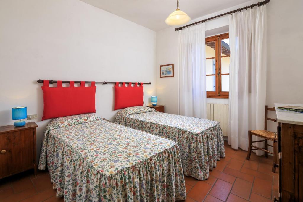 Posteľ alebo postele v izbe v ubytovaní Agriturismo Fattoria di Sommaia