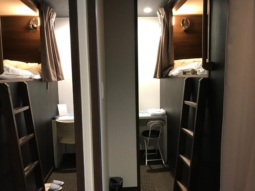 Postel nebo postele na pokoji v ubytování Hotel Famitic Nikko Station