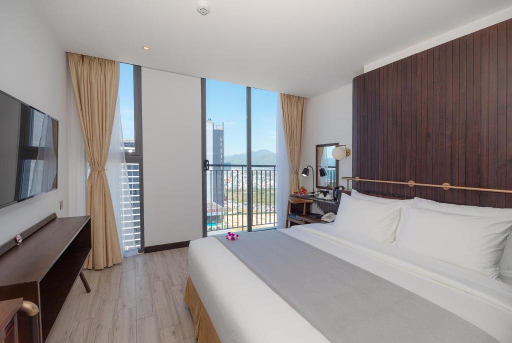 Ένα ή περισσότερα κρεβάτια σε δωμάτιο στο Majestic Premium Hotel