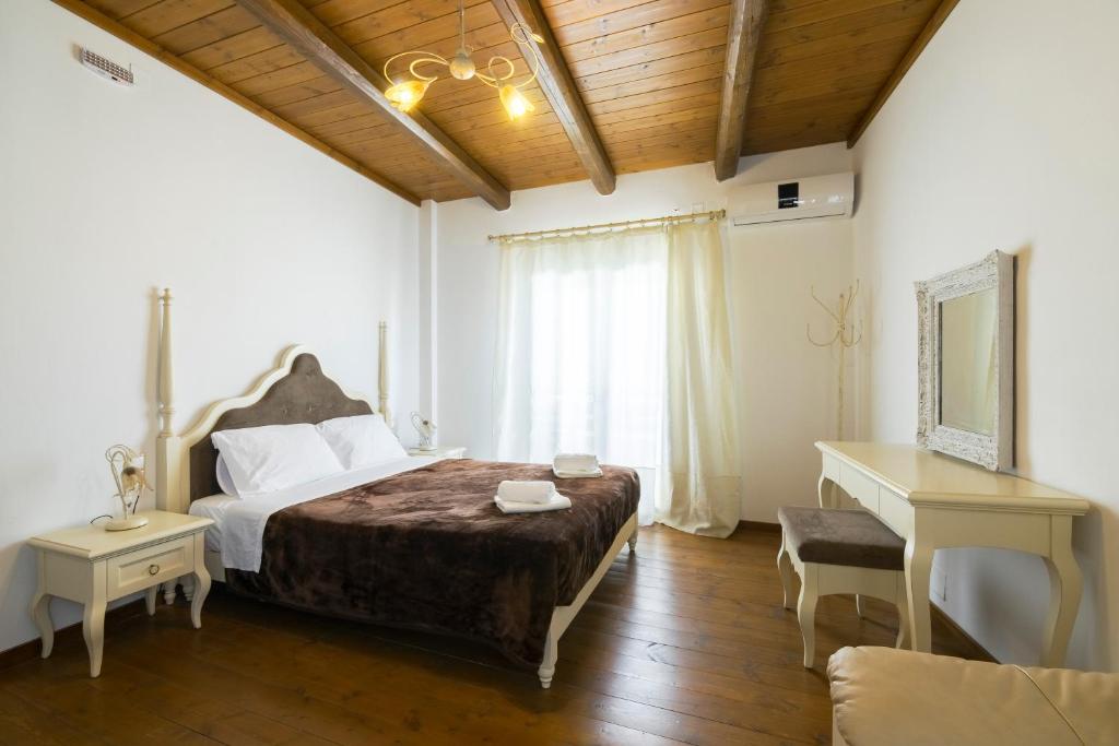 Postel nebo postele na pokoji v ubytování Zaros