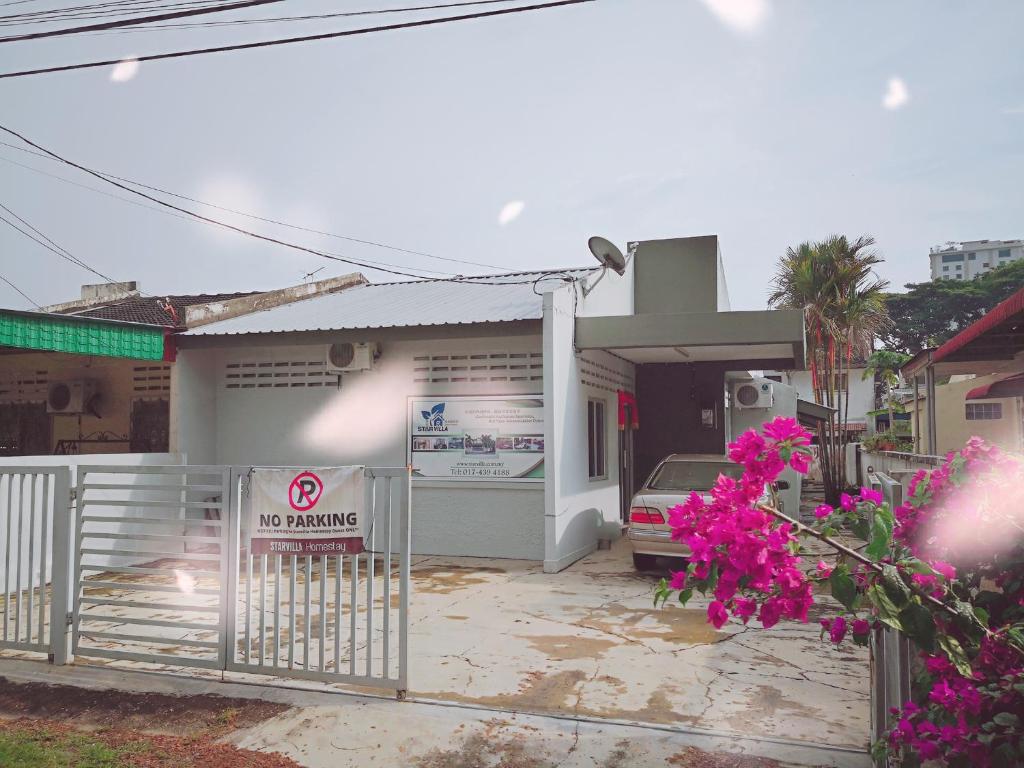 a house with a no parking sign in front of it at StarVilla Kinta River Front Medan Istana in Ipoh