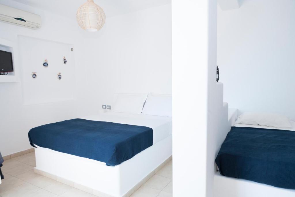 Postel nebo postele na pokoji v ubytování Harmony Hotel