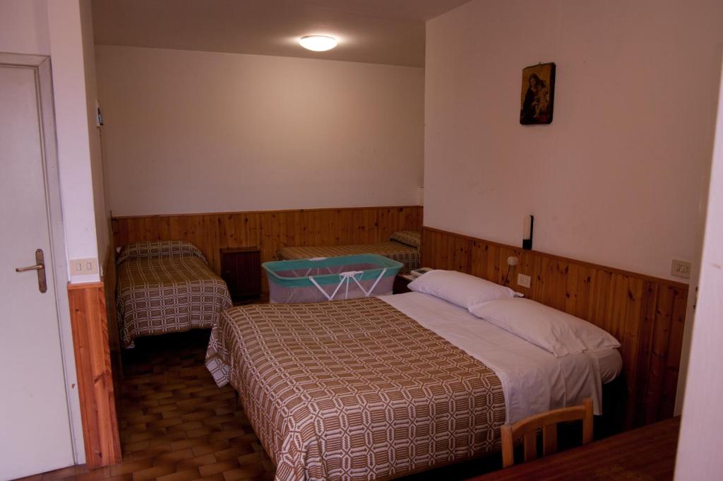 Postel nebo postele na pokoji v ubytování Cittadella Laudato Si'