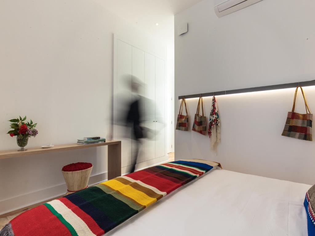 Postel nebo postele na pokoji v ubytování Heaven Inn Suites & Terrace