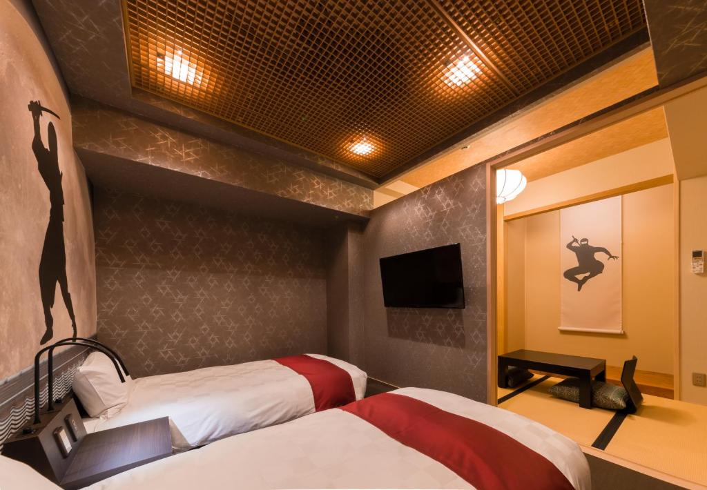 Postel nebo postele na pokoji v ubytování SARASA HOTEL Namba
