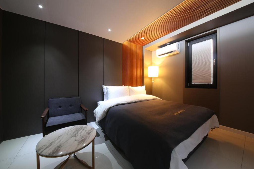 Postel nebo postele na pokoji v ubytování Hotel K