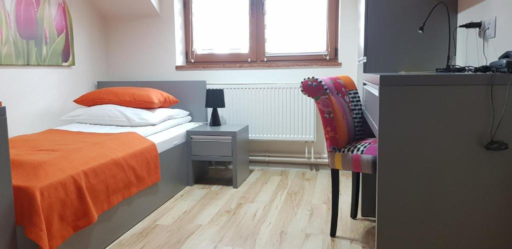 Postel nebo postele na pokoji v ubytování Hotel i Restauracja Pod Skałą Jasło