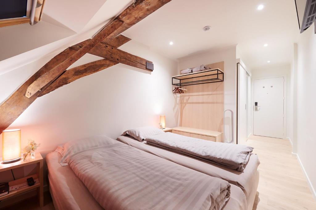 Postel nebo postele na pokoji v ubytování Hotel Royal Astrid