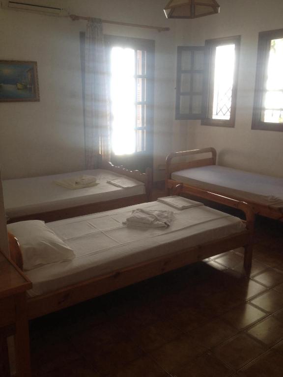 Postel nebo postele na pokoji v ubytování Kalama Apartments