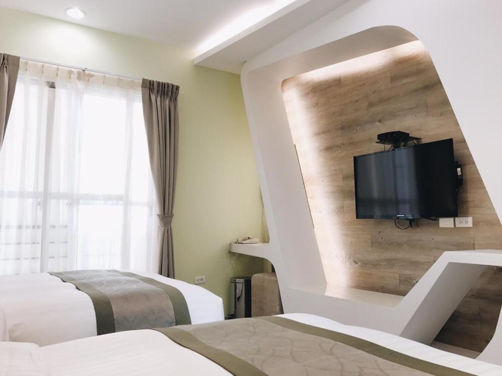Postel nebo postele na pokoji v ubytování Bai Sha Tan Cottage