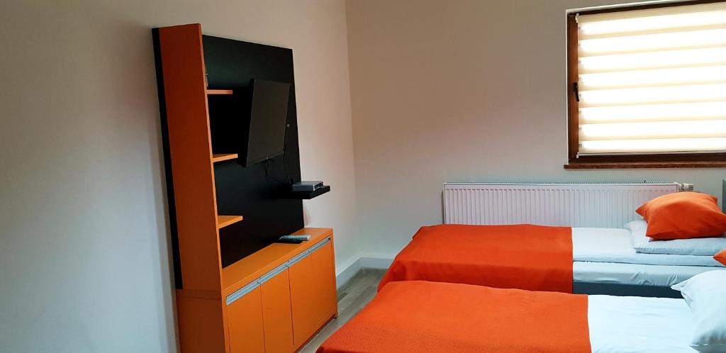 Postel nebo postele na pokoji v ubytování Hotel i Restauracja Pod Skałą Jasło