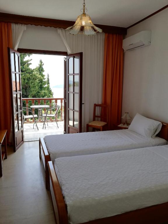 Postel nebo postele na pokoji v ubytování Hotel Paradise