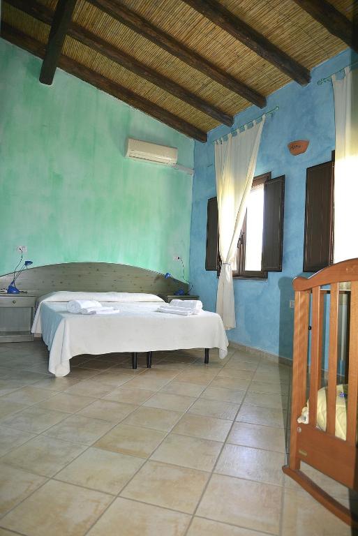 Postel nebo postele na pokoji v ubytování Agriturismo Rubinu