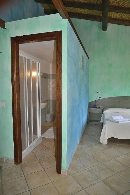 Postel nebo postele na pokoji v ubytování Agriturismo Rubinu
