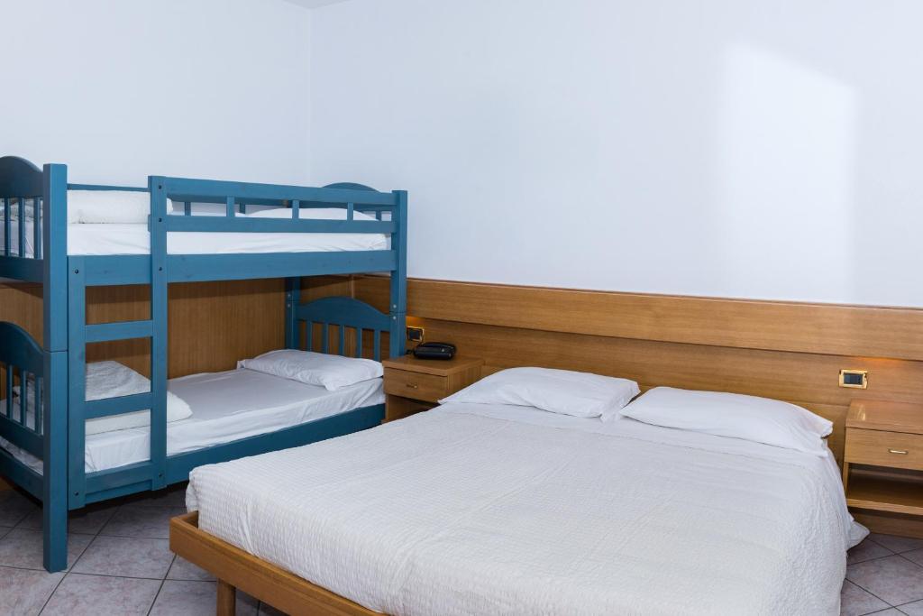 Postel nebo postele na pokoji v ubytování Albergo Ristorante Da Neni