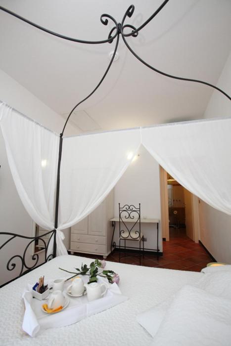 Postel nebo postele na pokoji v ubytování Rooms and Breakfast da Carla