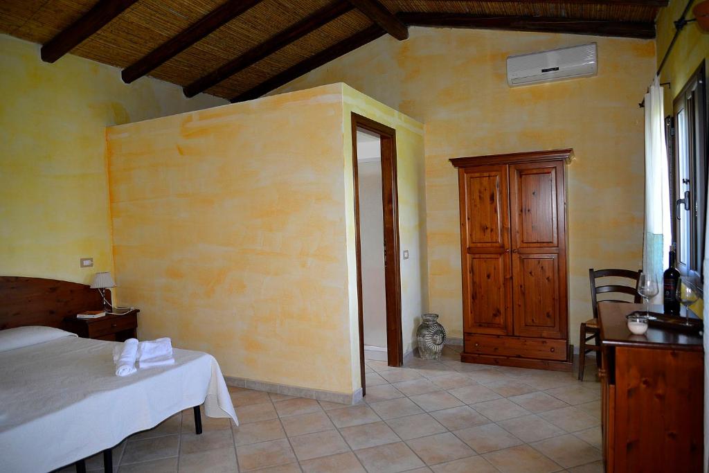 Postel nebo postele na pokoji v ubytování Agriturismo Rubinu