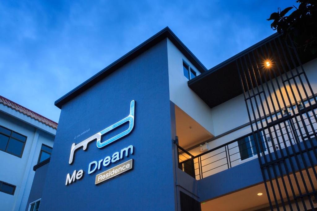 a building with a me program sign on it at Me Dream Residence in Surat Thani