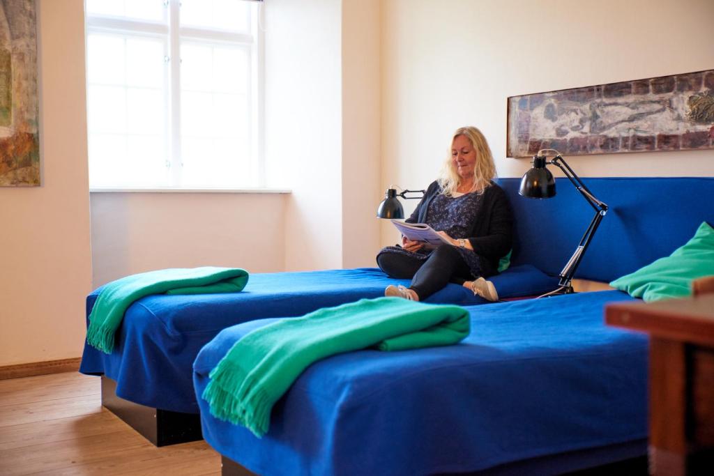 Postel nebo postele na pokoji v ubytování Danhostel Vitskøl Kloster