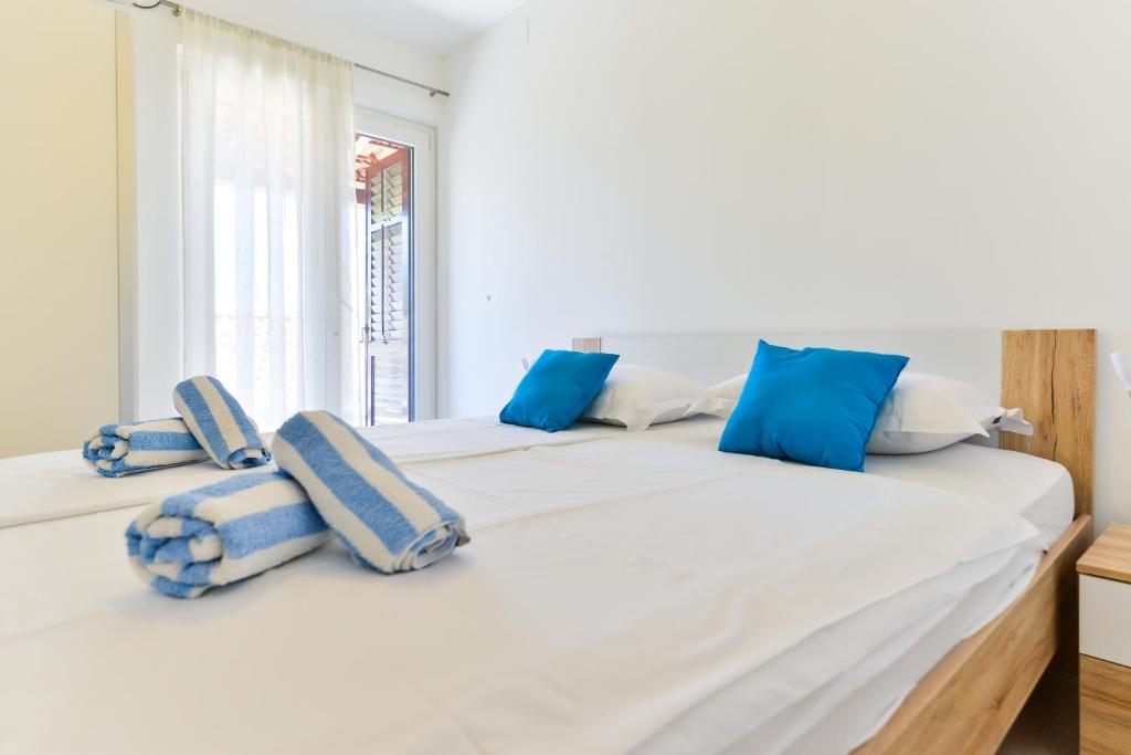 Posteľ alebo postele v izbe v ubytovaní Apartments Keran