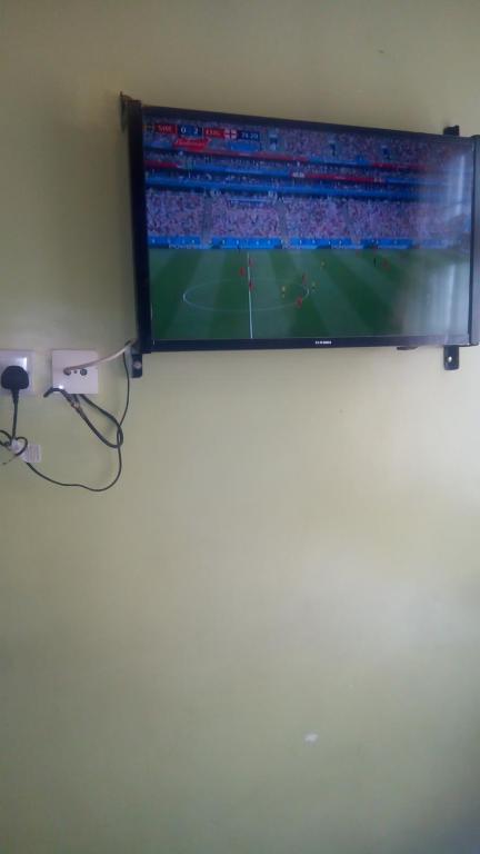 TV a/nebo společenská místnost v ubytování Ash White Hotel