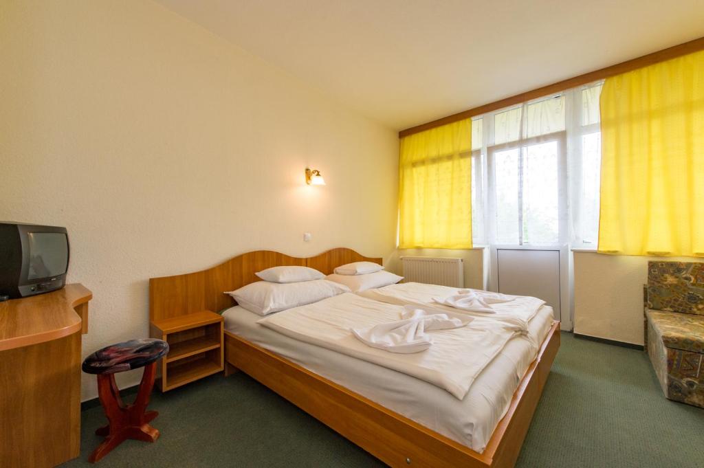 Postel nebo postele na pokoji v ubytování Hotel Nostra