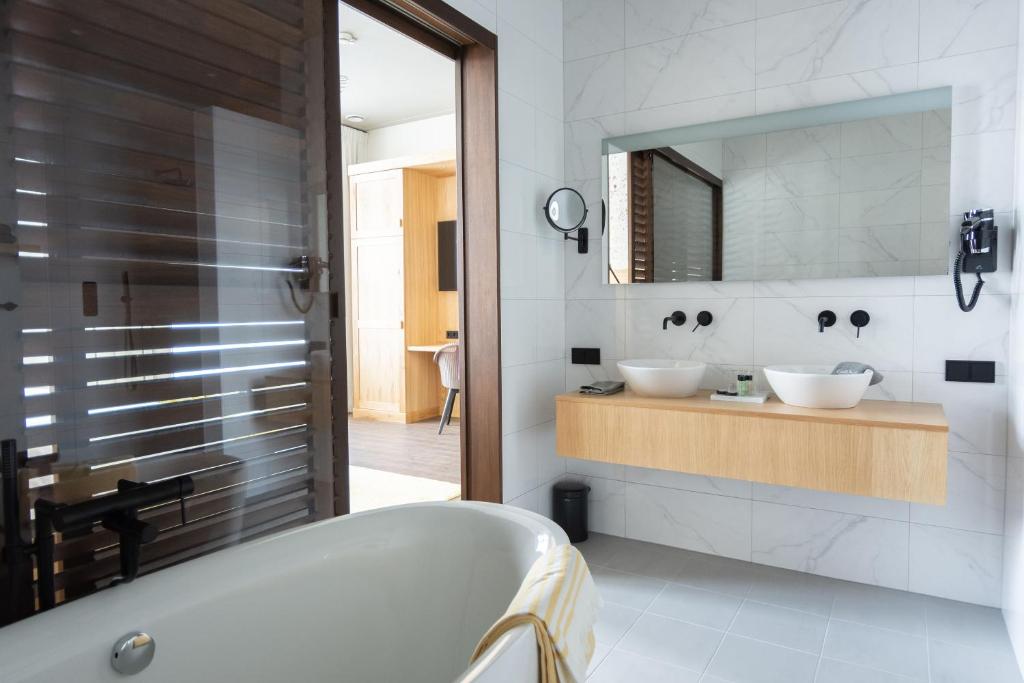 Een badkamer bij Boutique Hotel Catshuis