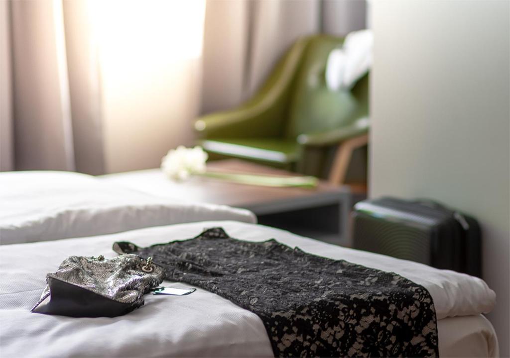 Postelja oz. postelje v sobi nastanitve Atelier Hotel